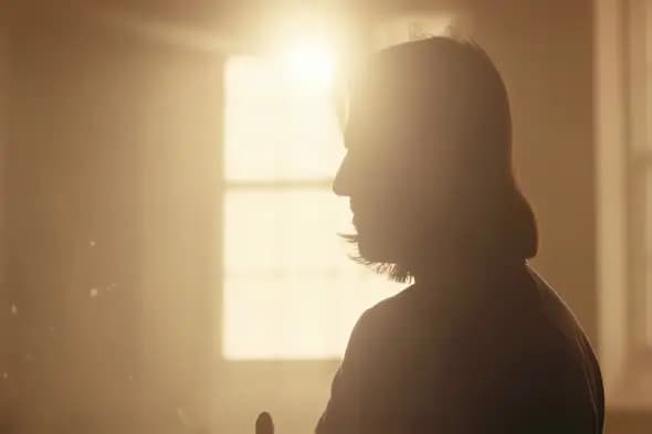 Atmospheric Silhouette Backlit by Golden Window Light