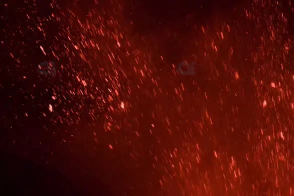 Fiery Ember Particles Falling in Dark Background