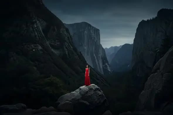 Solitary Red Figure in Mountain Valley