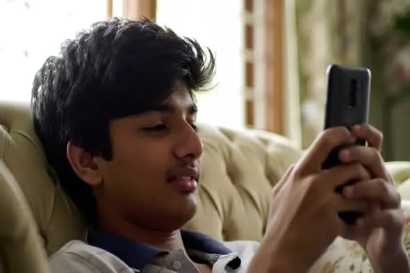 Smartphone Browsing on Sofa