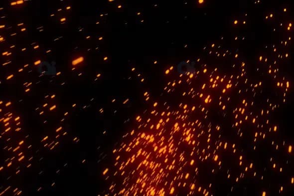 Sparks and Glowing Embers Falling on Dark Background