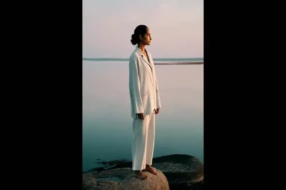 Indian Woman in White Suit by the Water