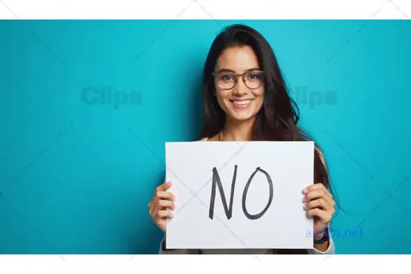 Woman Smiling Holding "No" Sign