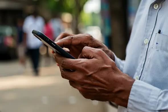Senior Hands Navigating Smartphone