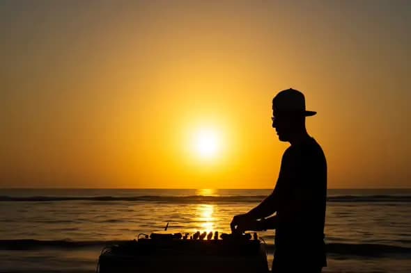 Sunset DJ Silhouette on Beach