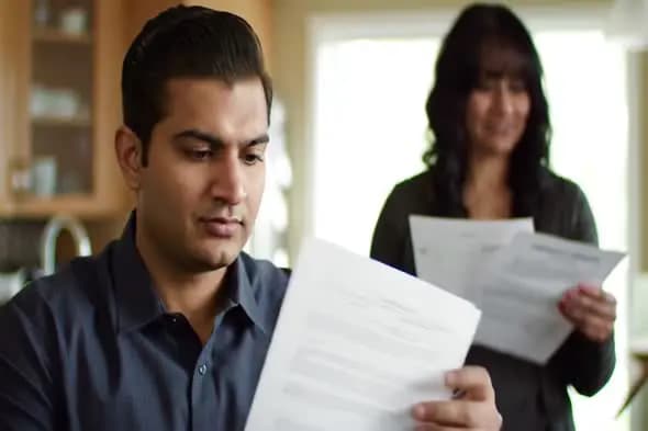 Couple Reviewing Important Documents