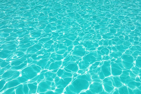 Turquoise Pool Water with Sunlit Reflections