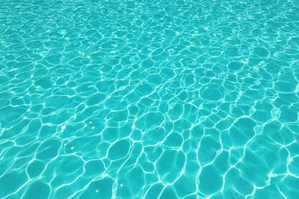 Clear Blue Pool Water with Sunlight Reflections
