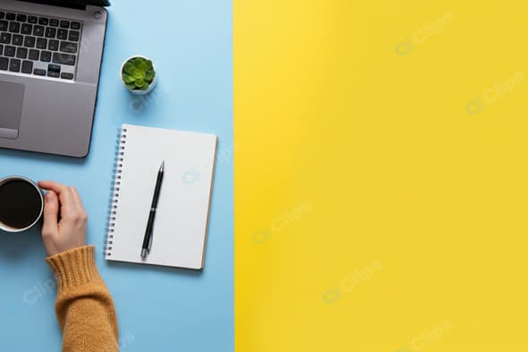 Workspace Desktop with Laptop and Coffee Cup on Colorful Background