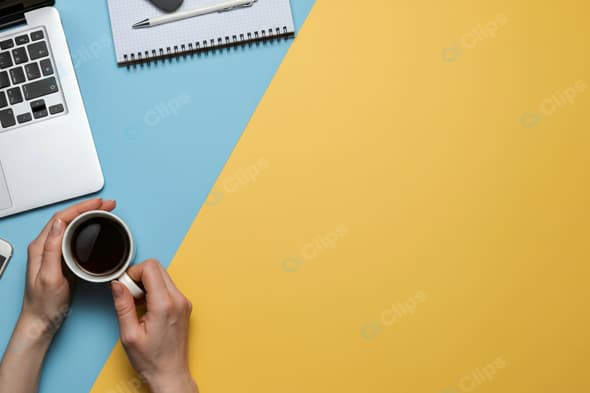 Workspace Desk with Laptop, Coffee, and Smartphone
