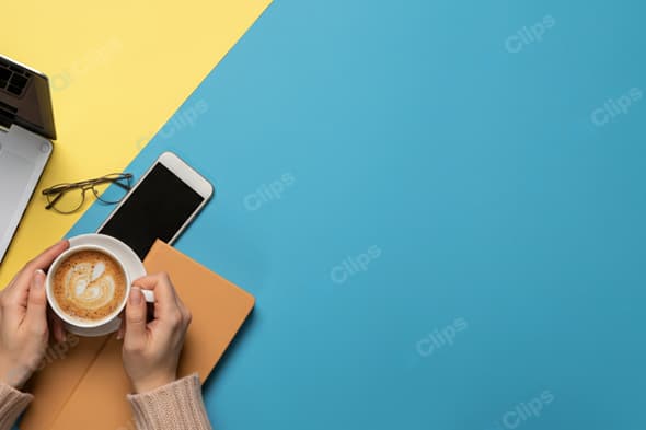 Workspace with Coffee, Laptop, and Smartphone on Bright Background