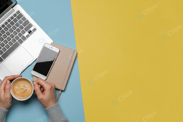 Top View Workspace with Laptop, Smartphone, and Coffee Cup