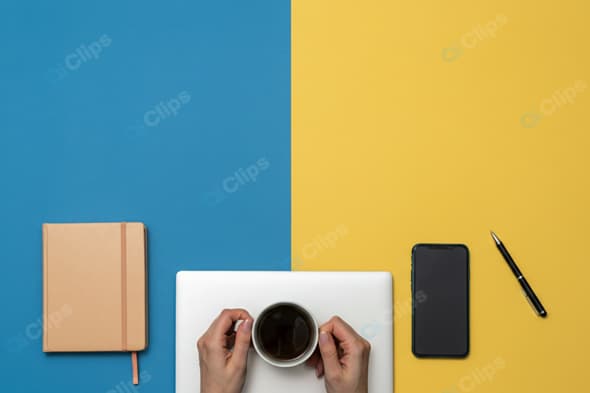 Coffee Break with Notebook, Smartphone, and Pen on Colorful Background