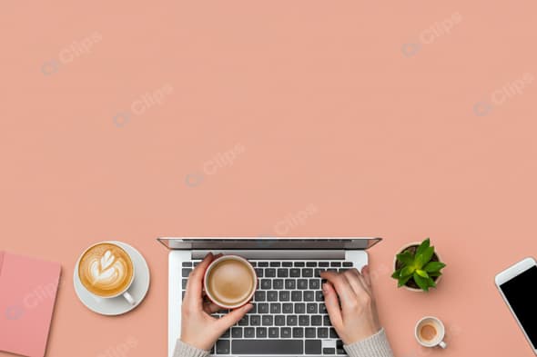 Laptop Workspace with Coffee and Smartphone on Pink Background