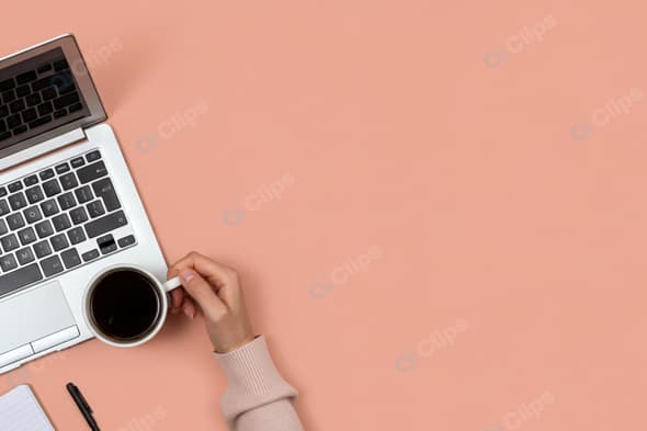 Laptop and Coffee Workspace with Notepad and Pen