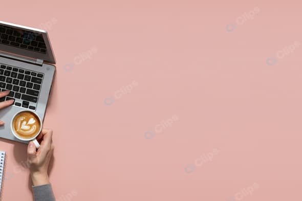 Laptop Workspace with Coffee on Pink Background