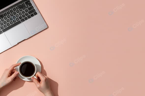 Laptop and Coffee Workspace on Peach Background