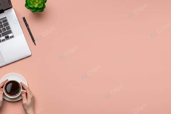 Laptop Workspace with Coffee on Pink Desk