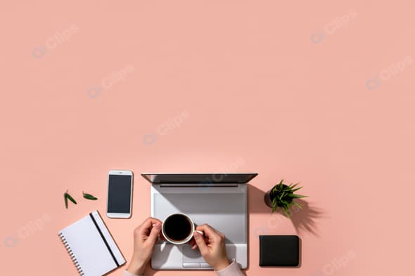 Workspace Flat Lay with Laptop, Coffee, Smartphone, and Notebook on Pink Background