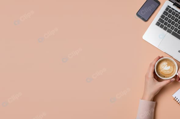 Coffee Break with Laptop and Smartphone on Desk