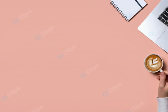 Laptop with Coffee Cup and Notebook on Pink Background