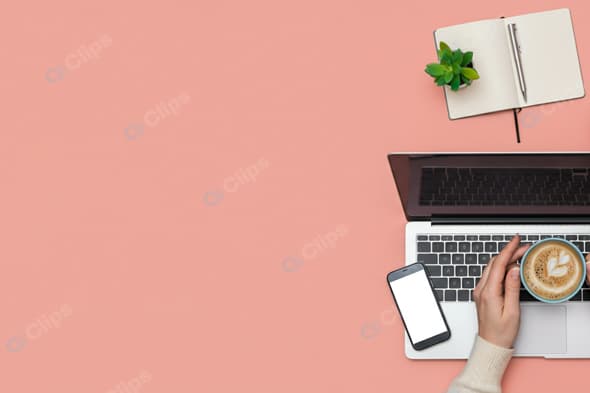 Laptop Workspace with Coffee, Smartphone, and Notebook on Pink Background