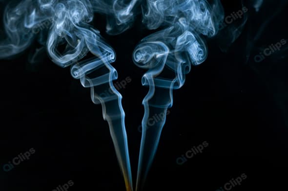 Mystical Blue Smoke Swirls Against a Black Background
