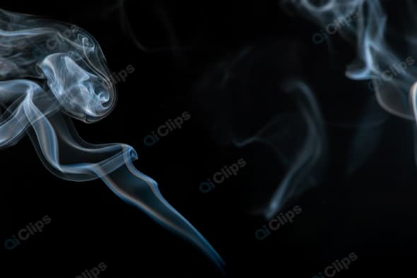 Wisps of White Smoke on Black Background