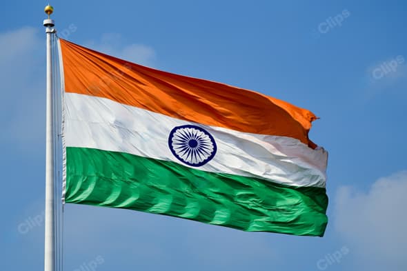 Indian National Flag Waving Against Blue Sky