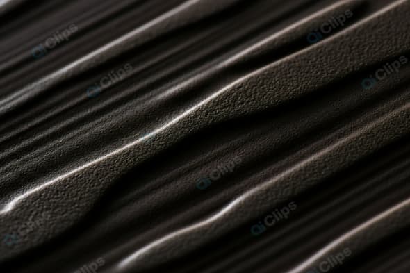 Dark Textured Surface with Wavy Pattern Close-up