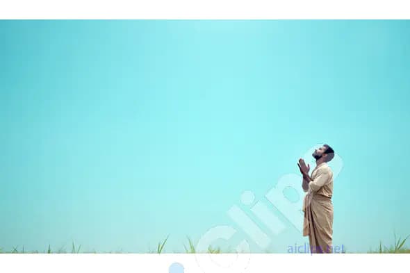 Man Praying in Nature Against a Vast Blue Sky