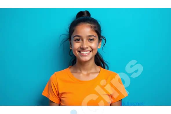 Smiling Young Girl in Bright Orange T-Shirt Against Blue Background