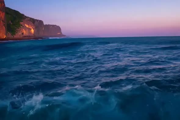 Coastal Cliffs at Twilight with Turbulent Ocean Waves
