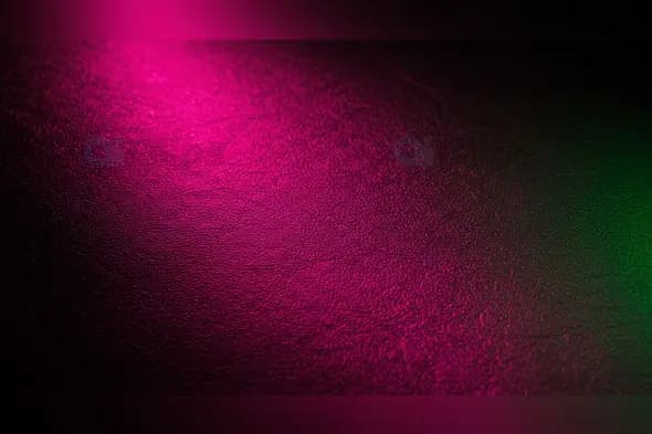 Textured Leather Background with Pink and Green Highlights