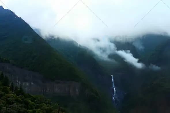 Misty Mountain Valley with Cascading Waterfall