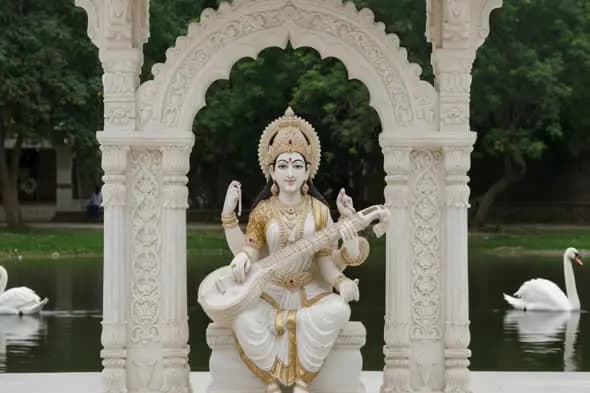 Divine Statue of Goddess Saraswati in Marble Temple by the Lake