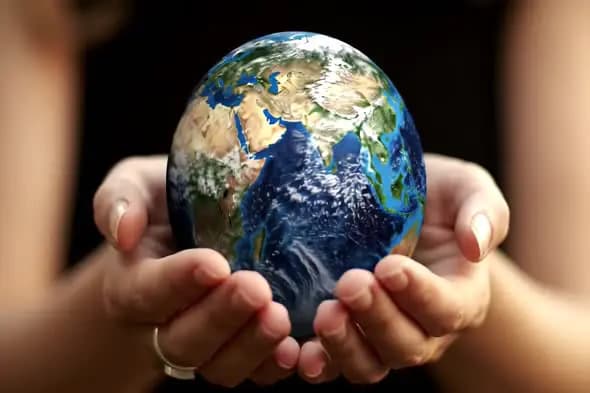 Hands Cradling Earth Globe
