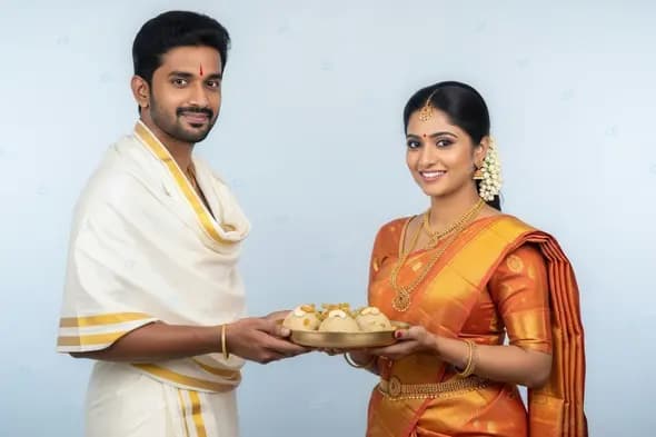 Traditional South Indian Couple Offering Sweets